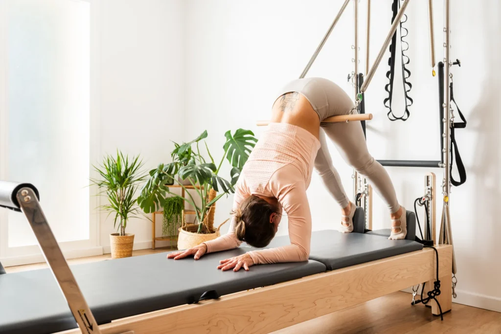 woman practicing pilates short spine massage exerc 2026 01 09 12 00 10 utc