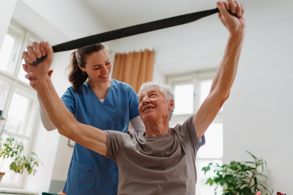 senior man doing physical therapy with young adult 2026 01 05 22 58 59 utc