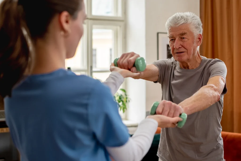 senior man doing rehab exercises with young adult 2026 03 10 02 06 11 utc